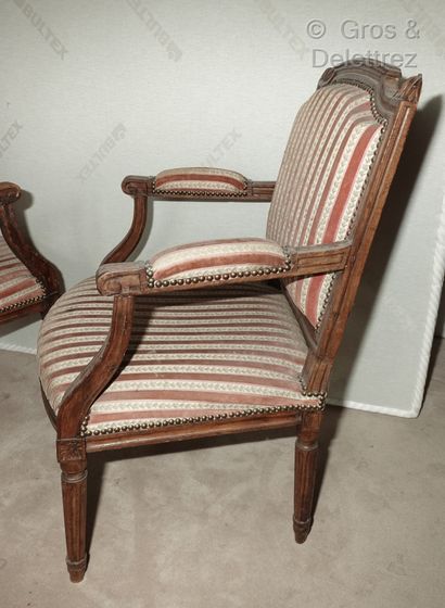 null Pair of armchairs in moulded and carved natural wood, the flat backs in the...