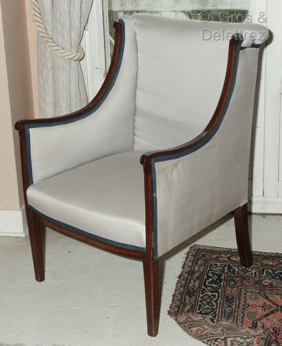 null Mahogany wing chair inlaid with light wood fillets, the back with a slight scroll,...
