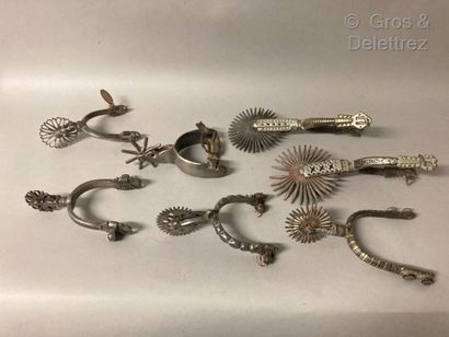  Set of seven iron spurs, some damascene, and a bronze bit. 
19th century 
Good to...