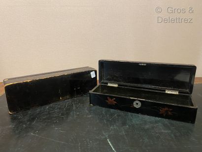 null Japan. Pair of black and gold lacquered wooden boxes decorated with a bird and...