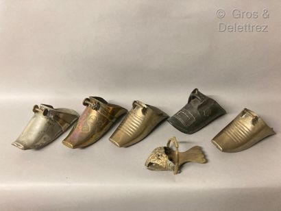 null Lot of eight bronze and tin stirrups. Five in the shape of a shoe, a pair signed...