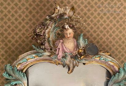 null Meissen

A polychrome porcelain mirror with gold highlights, of violoné form,...