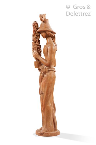 Travail 1940-1950 "Woman with a flower and a bird

Terracotta sculpture

H : 135...