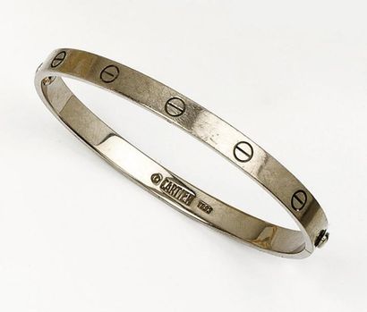 CARTIER « LOVE »- Bracelet jonc ouvrant en or gris à décor de vis. Signé Cartier...