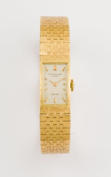 PATEK PHILIPPE Bracelet montre de dame en or jaune, cadran argent, mouvement mécanique,...