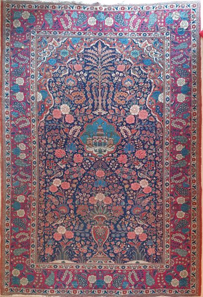 A Kashan prayer rug with a curved mihrab,...