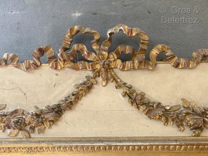 null Moulded and carved wood trumeau with a grey lacquered top decorated with a garland...