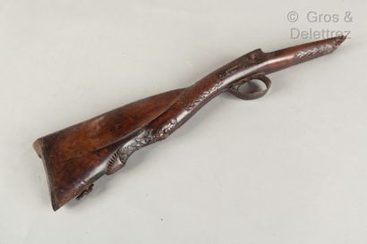 null Walnut rifle stock carved with a faun's head. The lock is signed Evrard. Accidents...