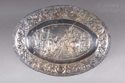 null Large silver plated oval dish with repoussé decoration of the "Surrender of...