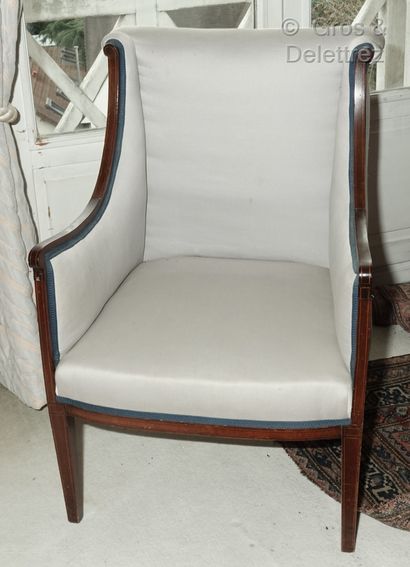 null Mahogany wing chair inlaid with light wood fillets, the back with a slight scroll,...