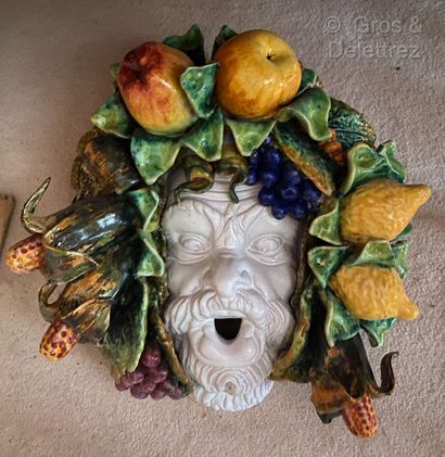 null Decorative ceramic mask with a bearded man wearing a crown of polychrome fruits.

Italian...