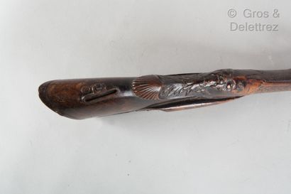null Walnut rifle stock carved with a faun's head. The lock is signed Evrard. Accidents...