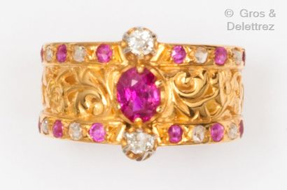 null Sultana" ring composed of a yellow gold ring chased with foliage and scrolls,...