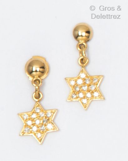 Pair of yellow gold earrings, holding a star...