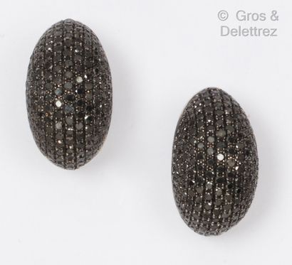 null Pair of white gold earrings, each with a dome paved with black brilliant-cut...