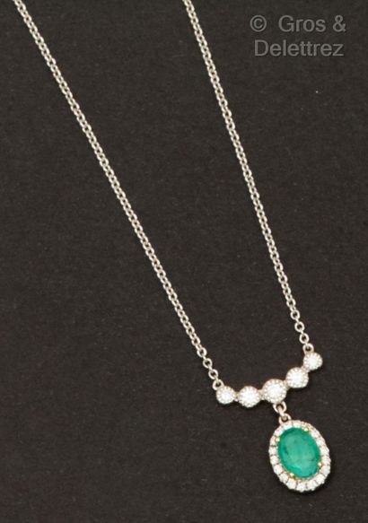 null White gold necklace, set with an oval emerald held by a drop of brilliant-cut...