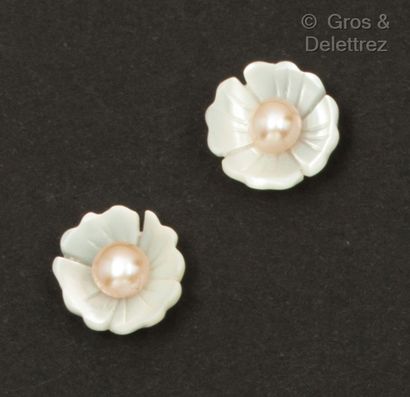 null Pair of white gold "Flower" earrings, the chased mother-of-pearl design centered...