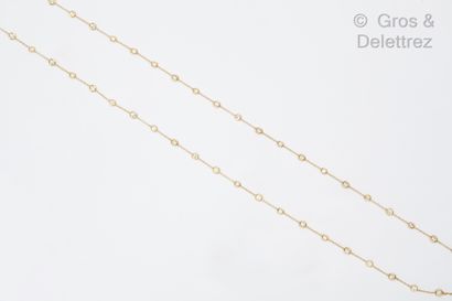 null A large yellow gold sautoir, consisting of a chain of forçat links alternating...