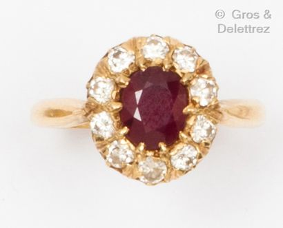 null Yellow gold "Flower" ring, set with an oval faceted ruby in a brilliant-cut...