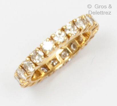Yellow gold wedding band, entirely set with...