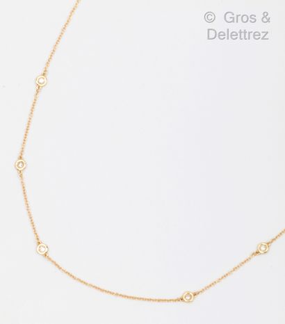 null Yellow gold chain (14K) punctuated with six brilliant-cut diamonds in closed...