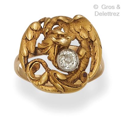 Yellow gold ring with an openwork chimera...