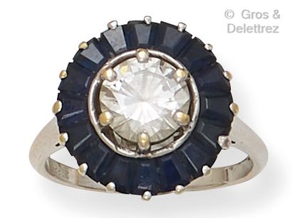 null Rhodium-plated gold "Skirt" ring, set with a brilliant-cut diamond in a circle...