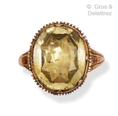 Yellow gold ring set with an oval citrine...