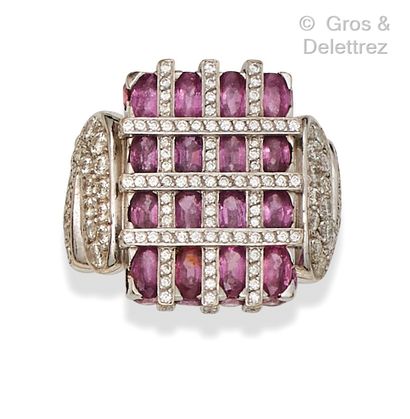 A white gold ring set with oval pink tourmalines...