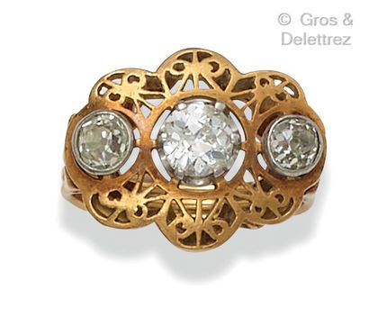 null Yellow gold openwork ring set with three old-cut diamonds. Finger size : 51....