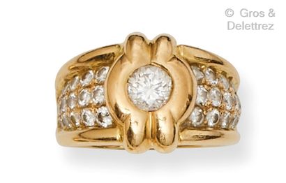 A yellow gold ring, set with a brilliant-cut...