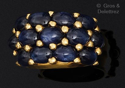 Yellow gold ring, set with sapphire cabochons....