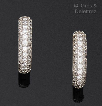 A pair of white gold hoop earrings, set with...