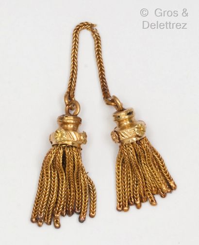Pair of yellow gold tassels with flower motifs....