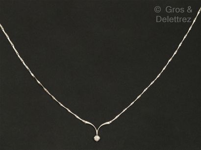 A white gold articulated necklace with stylized...
