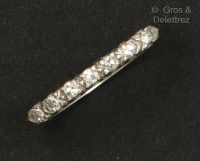 White gold wedding band, partially set with...