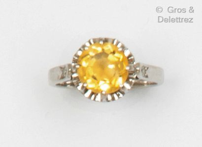 null White gold and platinum ring, set with a facetted citrine and two 8/8 cut diamonds....