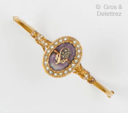 A yellow gold rigid opening bracelet, decorated...