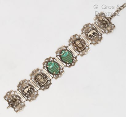null Articulated silver bracelet, the links highlighted with Egyptian motifs, elephants...