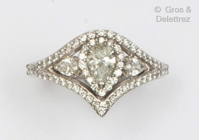 A white gold ring set with a pear-shaped...