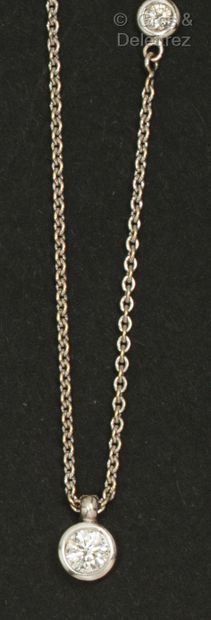 Chain and pendant in white gold, set with...