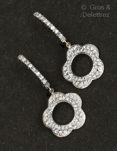 PASQUALE BRUNI Pair of white gold earrings, composed of hoop earrings holding a flower...