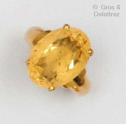 Yellow gold ring set with an oval citrine....