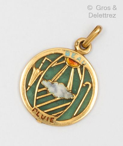 Yellow gold medal with a cloud and sun motif...
