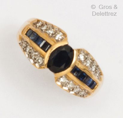 null Yellow gold "Jonc" ring, set with an oval sapphire, surrounded by lines of calibrated...