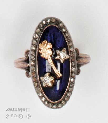 A yellow gold and silver ring with blue enamel,...
