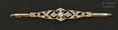 null A yellow gold and platinum "Barette" brooch with an openwork design of fleur-de-lis...