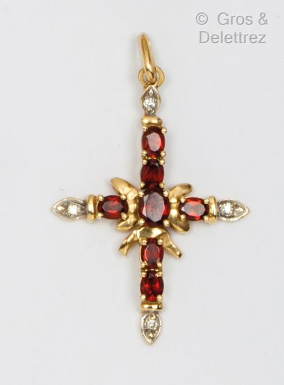 null Yellow gold "Cross" pendant set with faceted garnets and brilliant-cut diamonds....