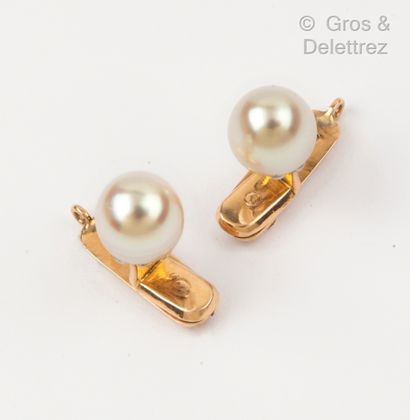 Pair of yellow gold collar buttons with a...
