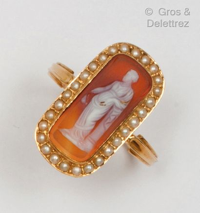 A yellow gold ring set with a cameo on cornelian...